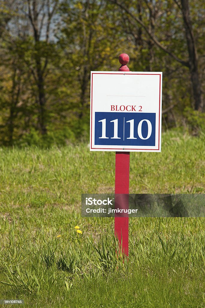 Open lot sign in unfinished residential development. Lot sign for two open lots in an unfinished residential development. Blue Stock Photo