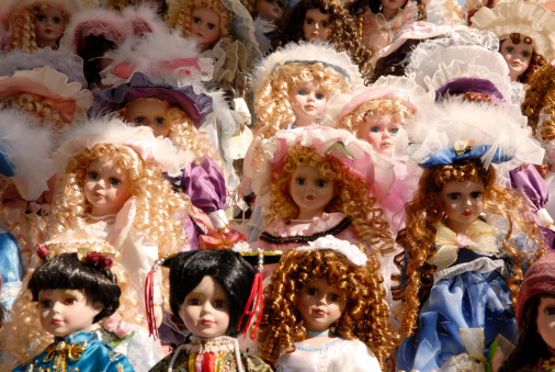 dozens of dolls on a sales booth