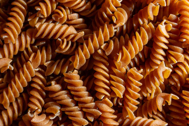 istock Uncooked Whole Grain Fusilli Pasta Background 1841088794