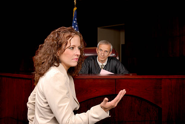 Presenting Her Case To The Judge Judge Listening To Attorney Present Her Case. legal defense photos stock pictures, royalty-free photos & images