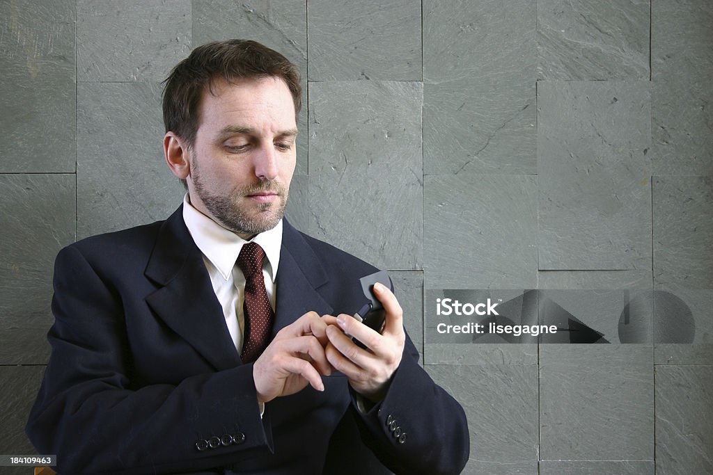 Hombre de negocios con una calculadora - Foto de stock de Adulto libre de derechos