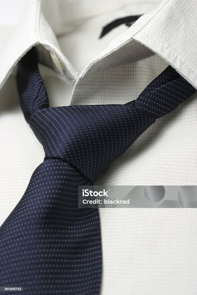 Loosen Up Necktie lossen up from a white shirt.Similar images - Beauty Stock Photo