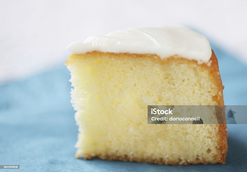 slice of cake lemon cake on blue napkin Cake Stock Photo