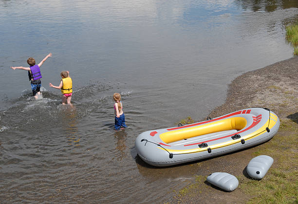 Kids and Raft stock photo