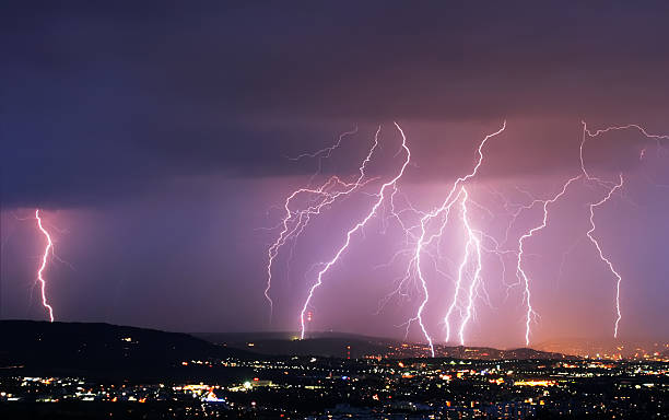 lightning over a city stock photo