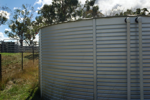 Large Australian tank catches rain water for household use. Device used for conserving water under drought conditions.