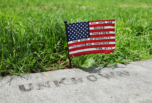 Unknown grave marker and United States flag with personal message.  Gettysburg National Military Park Cemetery
