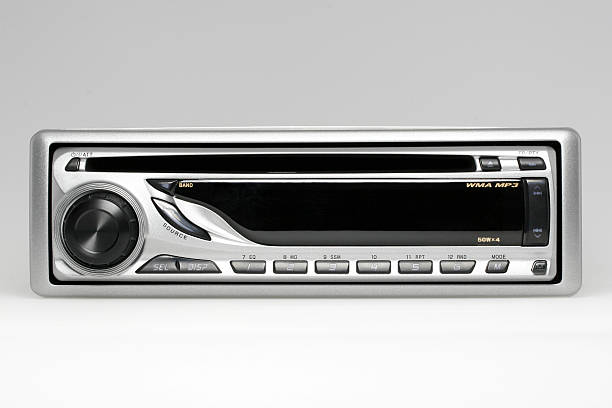 Car audio CD receiver Car audio receiver with CD/MP3 player isolated. open cd player stock pictures, royalty-free photos & images