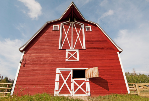 A bright red barn on the farm.
