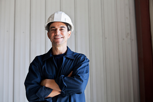 Portrait of mature man, 40s.  Manual worker in hard hat