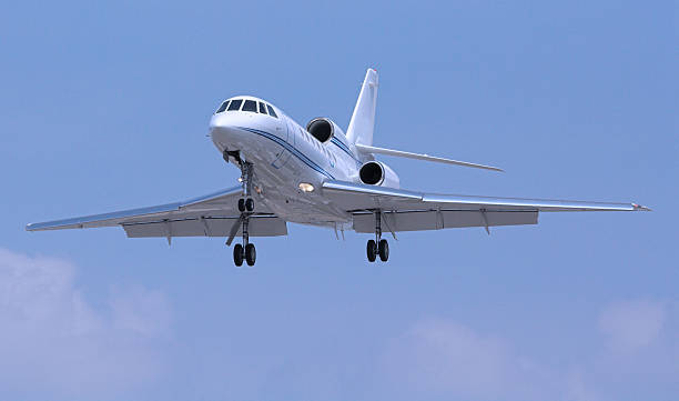 istock Small jet recently taken off with wheels still hanging out 184111167