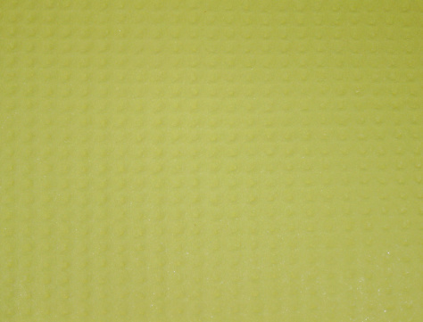 Closeup detail of yellow spongelike material.