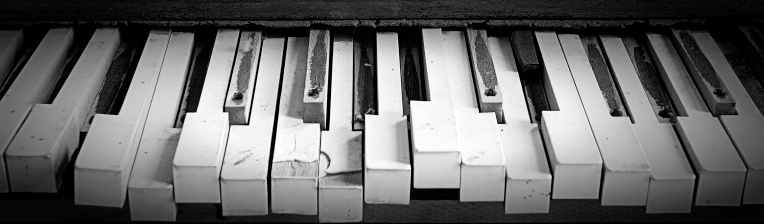 Old piano keys that have seen better days.
