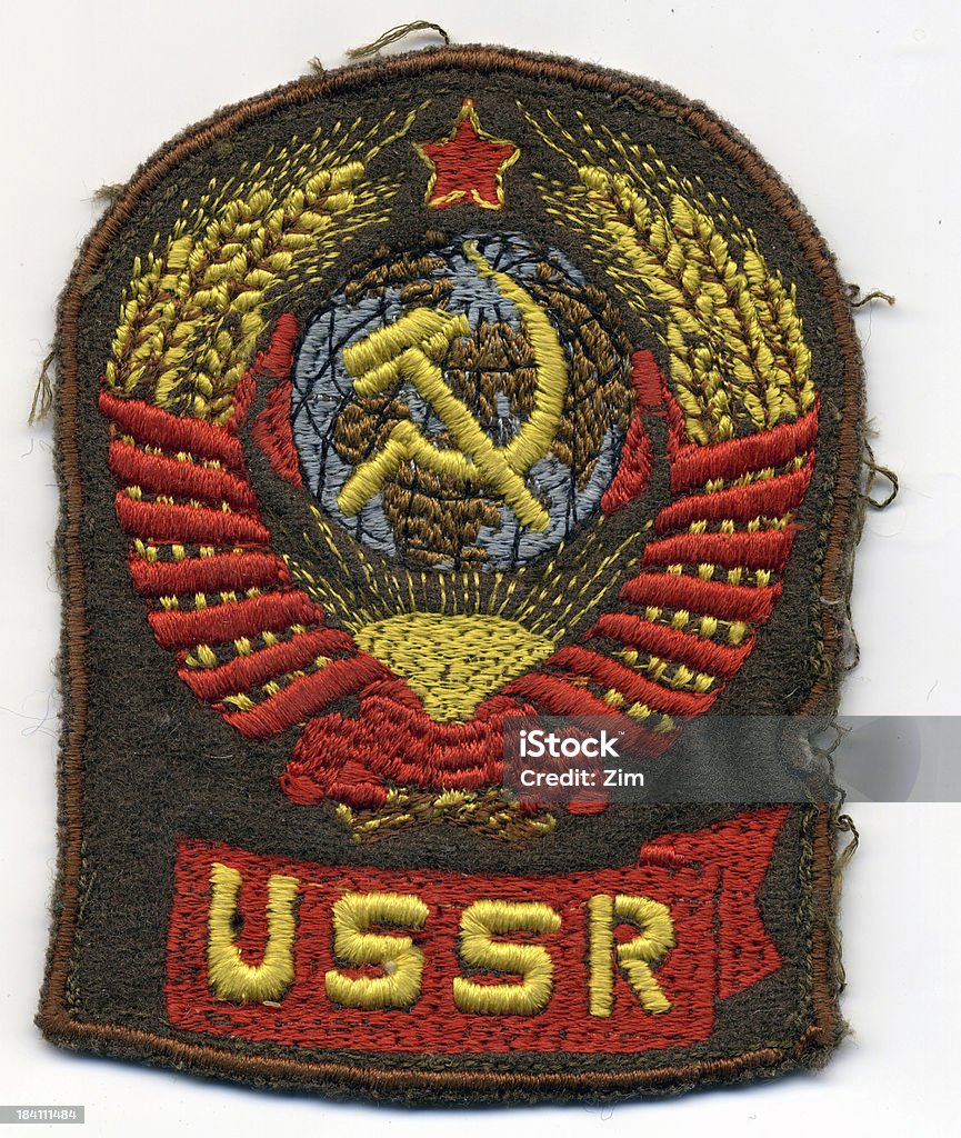 Ussr military badge "Military badge of Soviet army dated back to 80-90th of the last century. Sickle, hammer, red star - famous USSR's coat of arms from the years of Cold War." Armed Forces Stock Photo