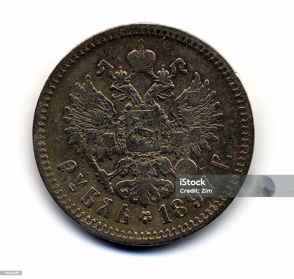 Old Russian coin "Old Russian coin (called 'Rubl') dated back to 1897 year. Pure silver. Tradional two-headed eagle, crown, scepter and other signs of kings on the coat of arms." 18-19 Years Stock Photo