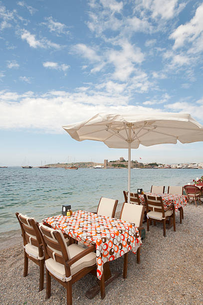 istock Seaside restaurant with sun umbrellas. 184111506