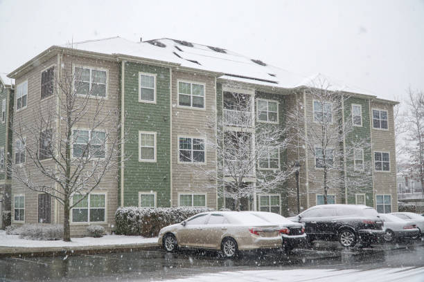 istock modern apartment building after winter snow storm 1841115725