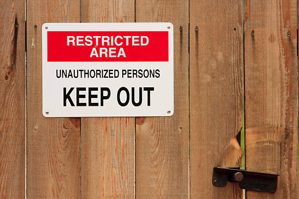 istock Restricted Area Unauthorized Persons Keep Out Sign on Wooden Fence 184112210