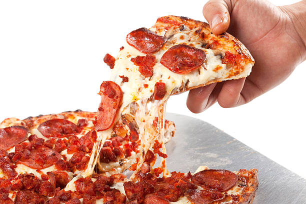 istock Grabbing a fresh slice of pizza. 184112347
