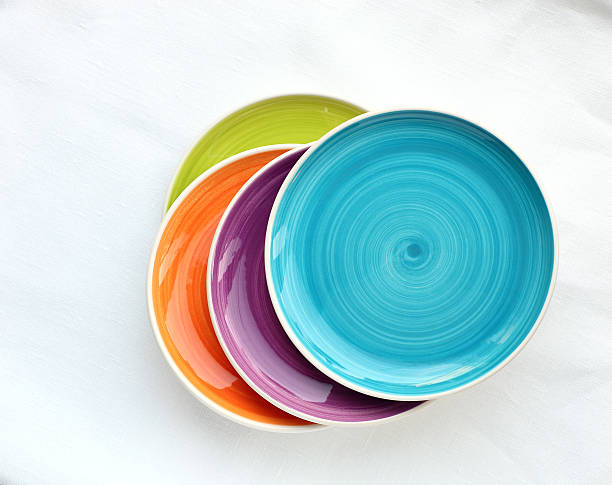 bunte gerichte - plate dishware stack multi colored stock-fotos und bilder