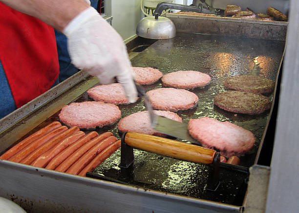 Flipping Burgers On The Grill