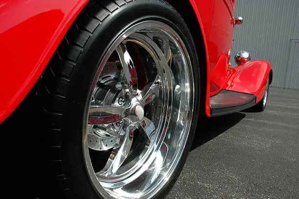 Low view of the rear wheel on a hot rod.