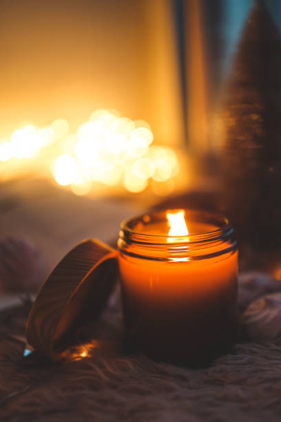 istock Burning candle in a festive cozy atmosphere 1841134514