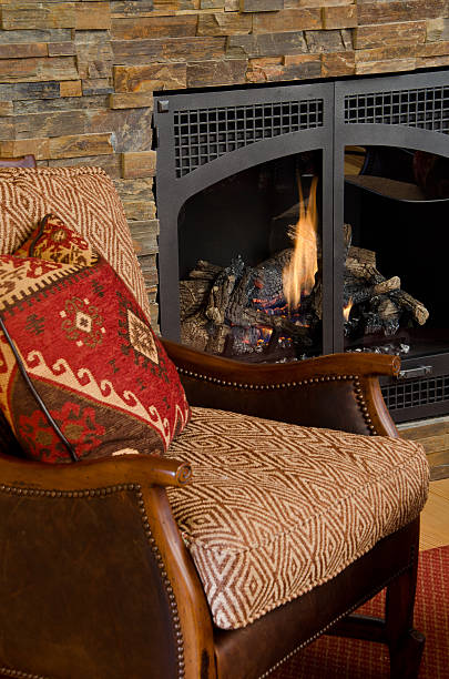 istock Close up of chair next to fireplace 184114320