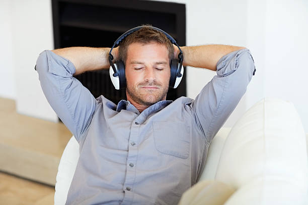 istock Man listening to soft music 184114650