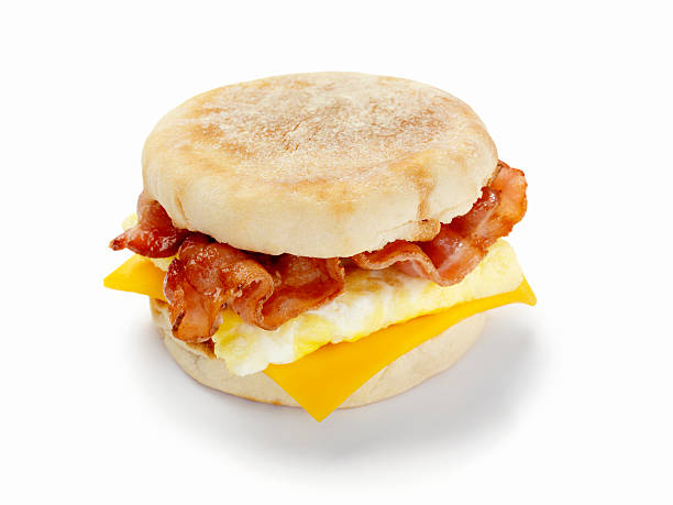 Bacon and Egg Breakfast Sandwich Bacon, Egg and Cheese Breakfast Sandwich on a Toasted English Muffin with a Natural Drop Shadow- Photographed on Hasselblad H3D2-39mb Camera breakfast stock pictures, royalty-free photos & images