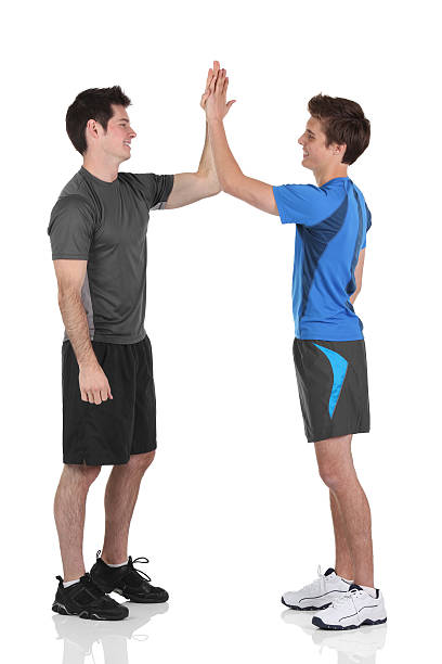 istock Two friends giving high five to each other 184115191