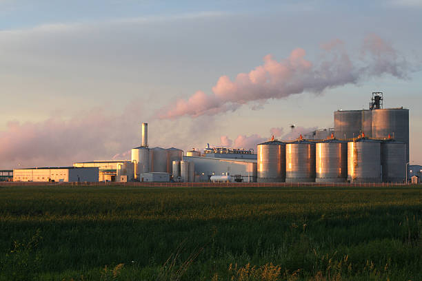 Ethanol Plant at Sunrise Ethanol Processing Plant in Iowa reflecting sunrise. ethanol photos stock pictures, royalty-free photos & images