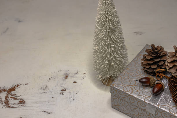 istock right side Christmas composition flat lay with silver gift box and white bottle brush tree 1841155233