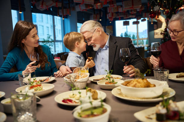 istock Playful aged man with little boy enjoying festive time spending together 1841164508