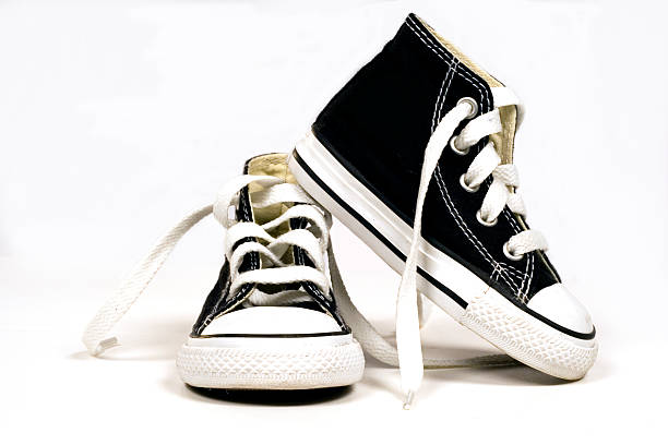 baby chucks baby chucks on white background high tops stock pictures, royalty-free photos & images