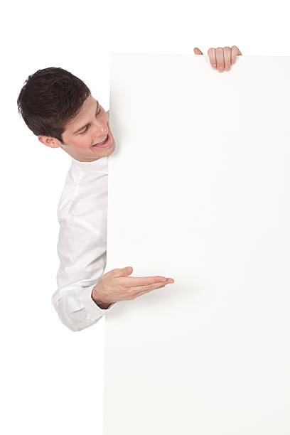 istock Happy businessman looking at a placard 184116948