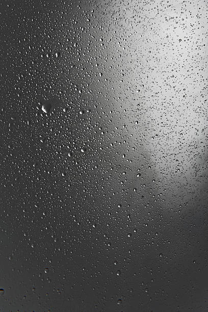 istock water drops on a glass pane 184118249