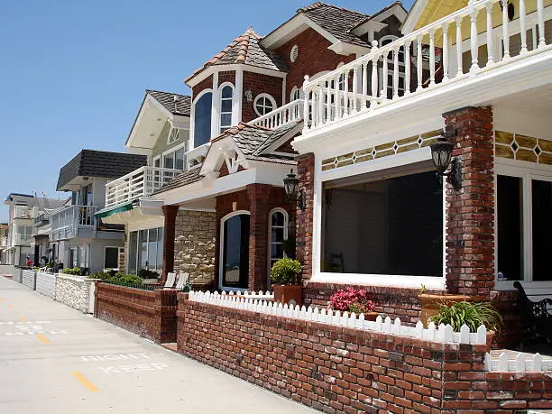 Oceanfront homes lined up along bikepath in Newport Beach, CA USA