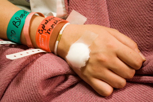 Medical bracelets on a hospital patient (all personal info removed)