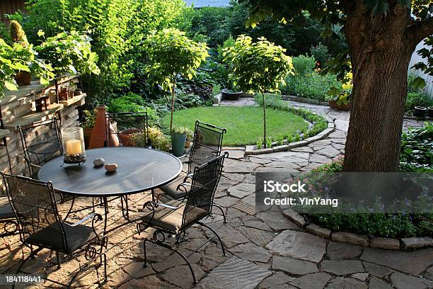 Landscaped Back Yard Patio Flower Garden With Natural Paving Stones Stock Photo - Download Image Now