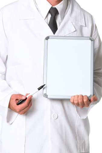 Close up of doctor pointing at blank white boardhttp://www.twodozendesign.info/i/1.png