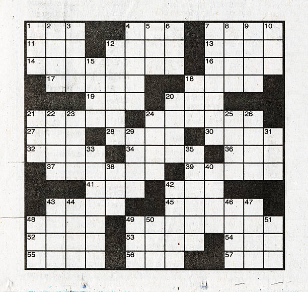 Crossword Puzzle Crossword puzzle printed in a newspaper. crossword stock pictures, royalty-free photos & images