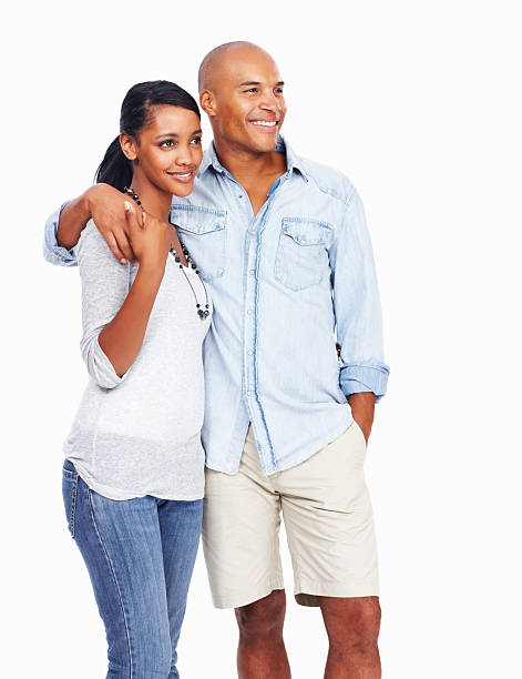 istock Beautiful young couple with arms around on white background 184119175