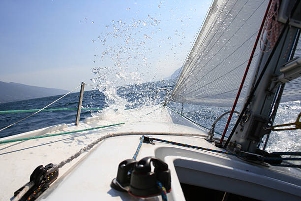 splash on sailing-yacht stock photo