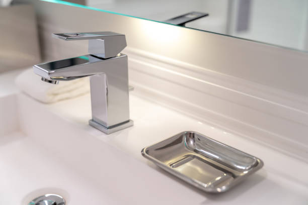 istock Modern sink faucet and soap dish in a hotel bathroom 1841199596