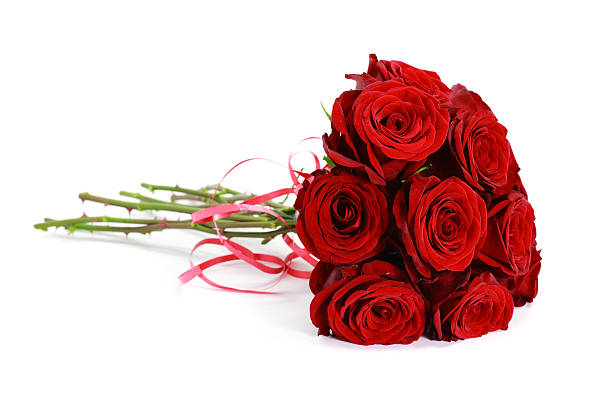 istock Bouquet of dark red roses isolated on white 184120258