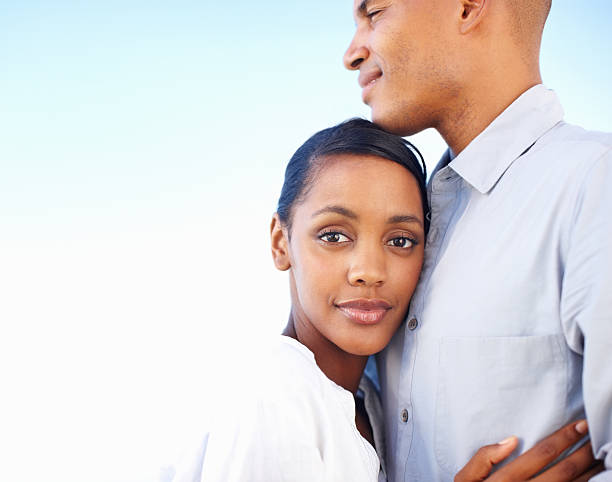 istock Couple embracing outdoors 184120388