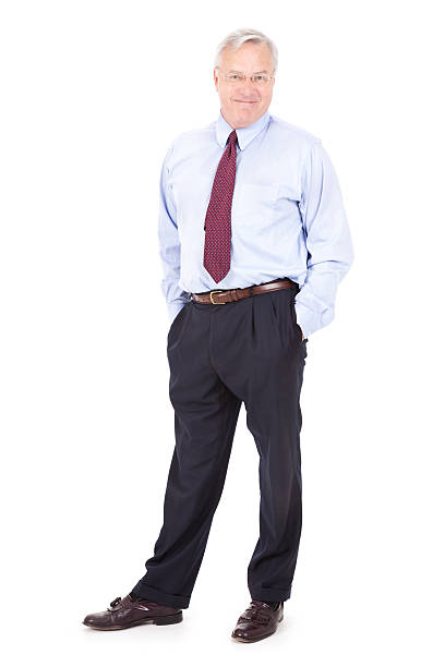 istock Happy Mature Businessman Standing With Hands in Pockets 184120697