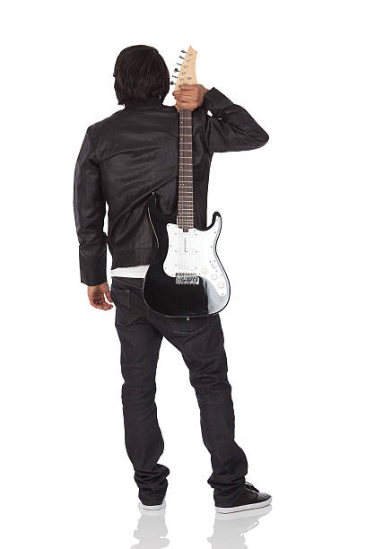 Rear view of a man standing with guitarhttp://www.twodozendesign.info/i/1.png
