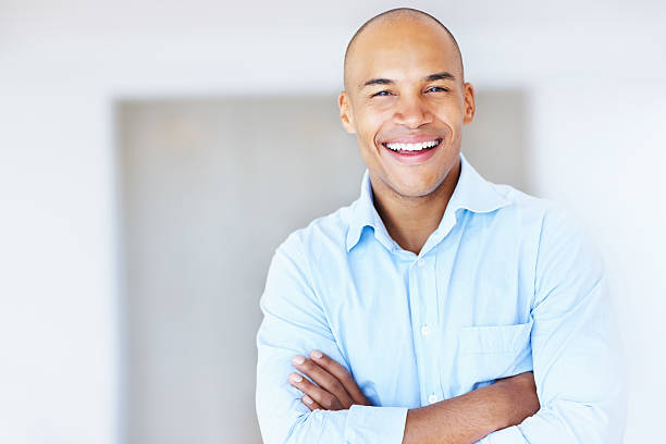 istock Friendly businessman with his arms crossed 184120918